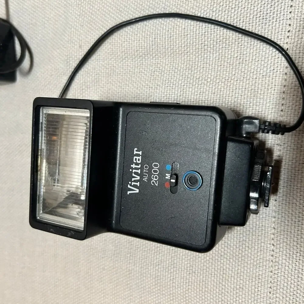 Vintage camera flashes and cases
